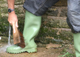 Washing wellies on farm