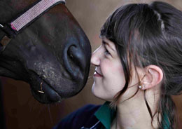 Vet nose to nose with a horse