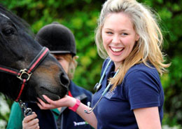 Happy vet with a horse